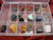 Several unique rocks organized in a desk organizer